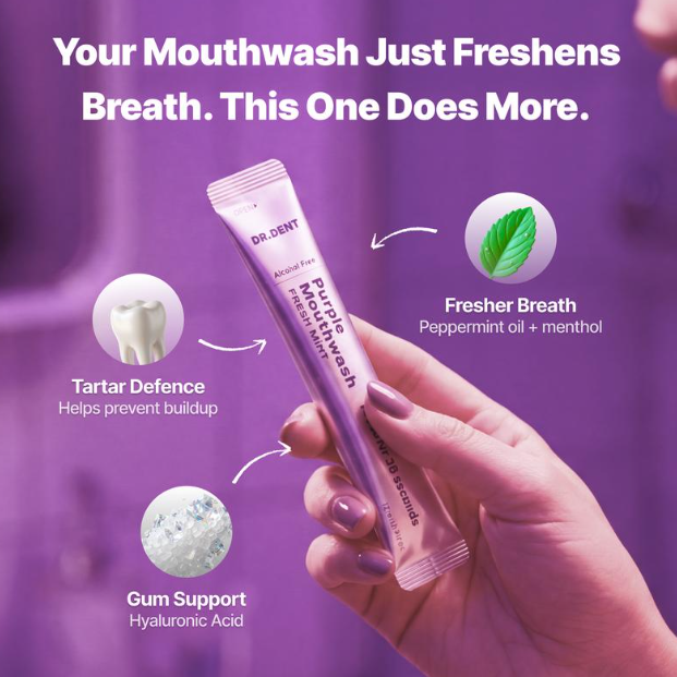 A hand holds a tube of Dr. Dent Purple Mouthwash against a purple background with marketing text and icons for breath freshness, tartar defence, and gum support.